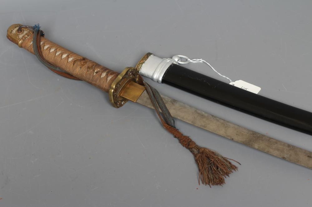 A JAPANESE KATANA with 26 1/4" curved blade, visible hamon, tang signed to both sides, WWII tsuba, Image