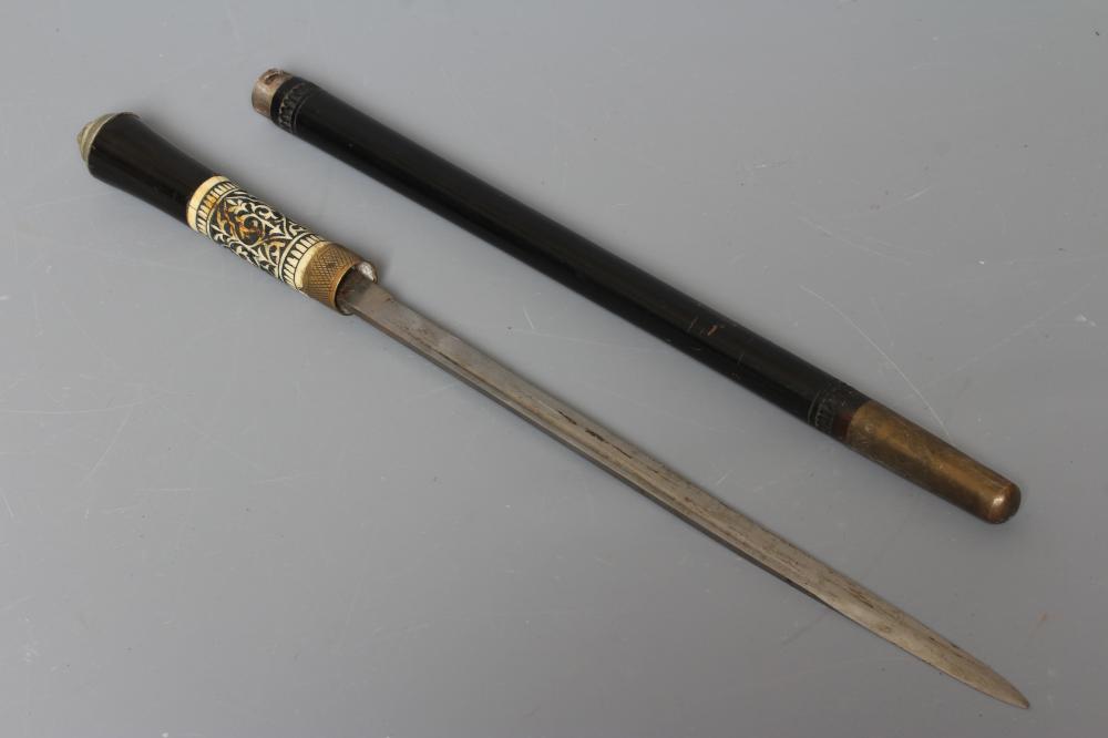 A SWORD SWAGGER STICK, early 20th century, the 14" fullered blade released with twist ferrule, Image
