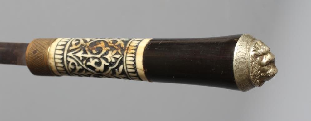 A SWORD SWAGGER STICK, early 20th century, the 14" fullered blade released with twist ferrule, Image