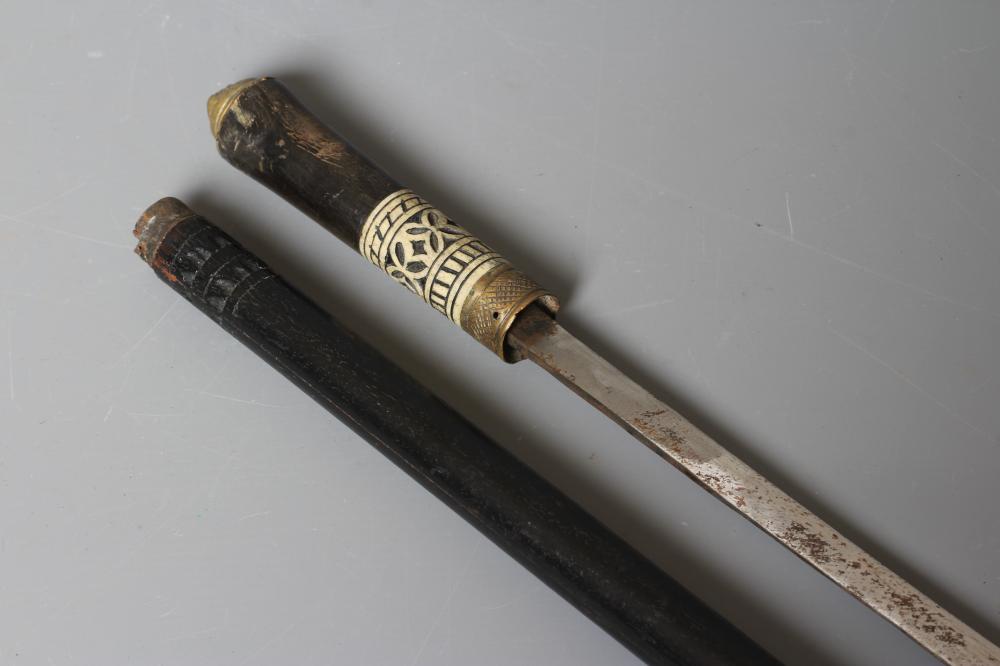 A SWORD STICK, early 20th century, the 23 1/4" blade released with twist ferrule, carved bone and Image