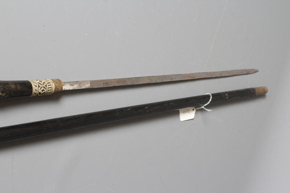 A SWORD STICK, early 20th century, the 23 1/4" blade released with twist ferrule, carved bone and Image