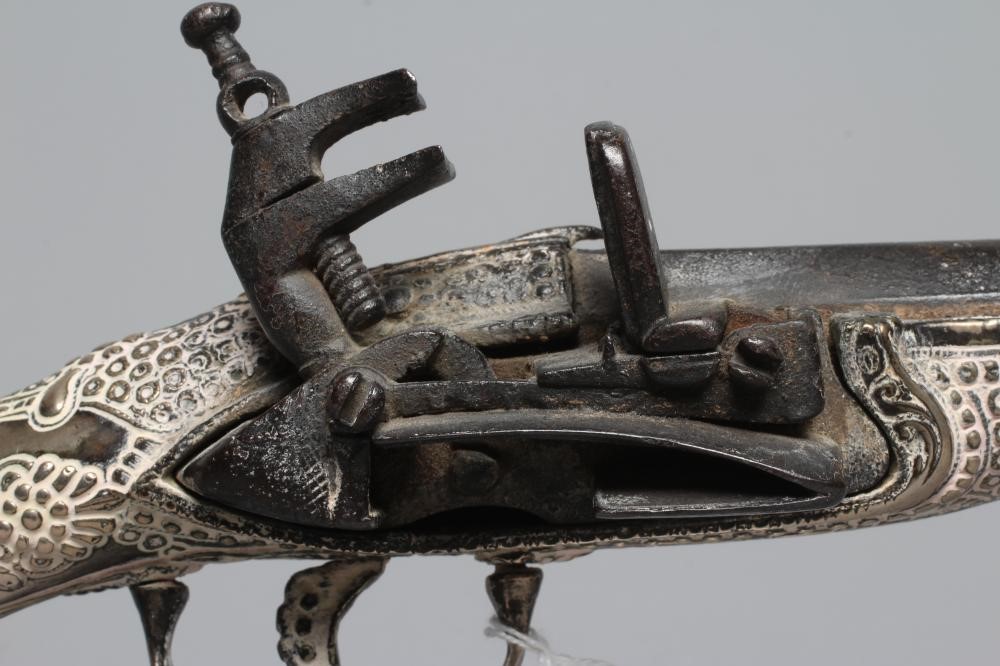 A TURKISH FLINTLOCK PISTOL, early 19th century, with 13 1/4" barrel, miquelet action, decorative Image
