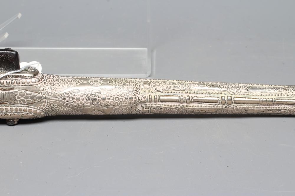 A TURKISH FLINTLOCK PISTOL, early 19th century, with 13 1/4" barrel, miquelet action, decorative Image