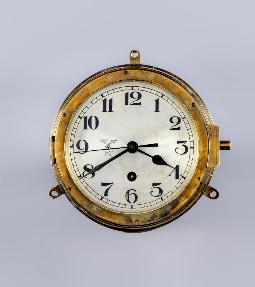A GERMAN THIRD REICH KRIEGSMARINE BRASS WALL CLOCK of bulkhead design with key opening door Image