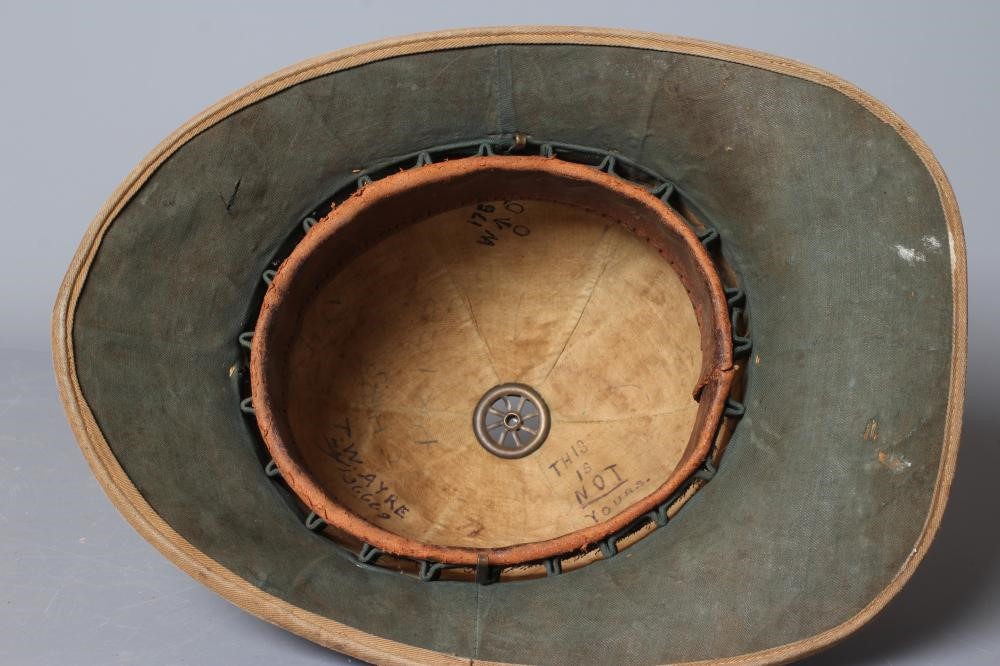 AN IMPERIAL CAMEL CORPS PITH HELMET with ICC badge, internal broad arrow stamp and inscribed to T. Image