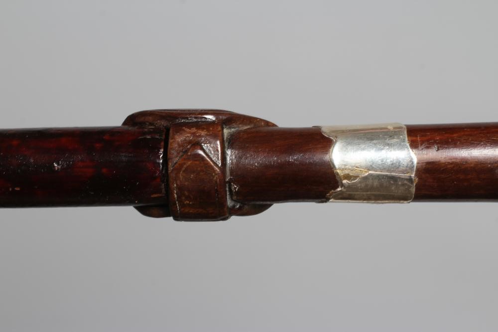 A SILVER MOUNTED SWORD STICK, Chester 1922, with 24 1/2" blued blade and buckle carved wood grip, 36 Image