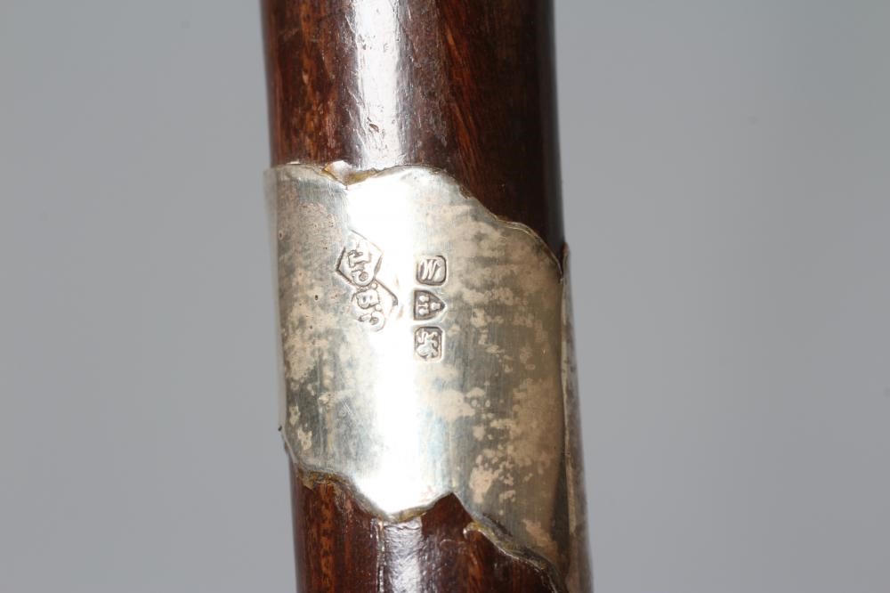 A SILVER MOUNTED SWORD STICK, Chester 1922, with 24 1/2" blued blade and buckle carved wood grip, 36 Image