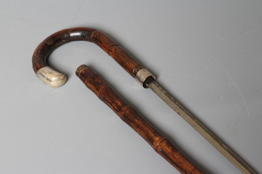 A SILVER MOUNTED SWORD STICK, London 1925, with 27 1/4" fullered blade, faux bamboo crook handle, Image