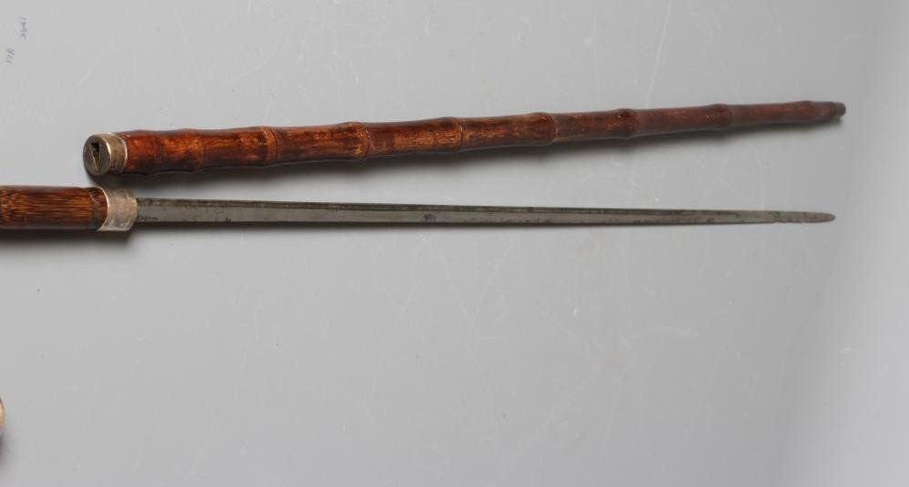 A SILVER MOUNTED SWORD STICK, London 1925, with 27 1/4" fullered blade, faux bamboo crook handle, Image