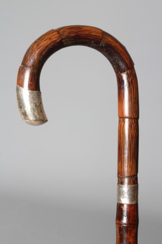 A SILVER MOUNTED SWORD STICK, London 1925, with 27 1/4" fullered blade, faux bamboo crook handle, Image