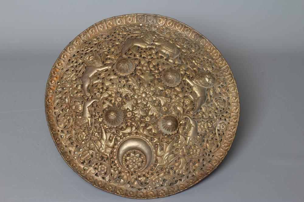 A CIRCULAR DHAL SHIELD decorated with a crescent moon Image