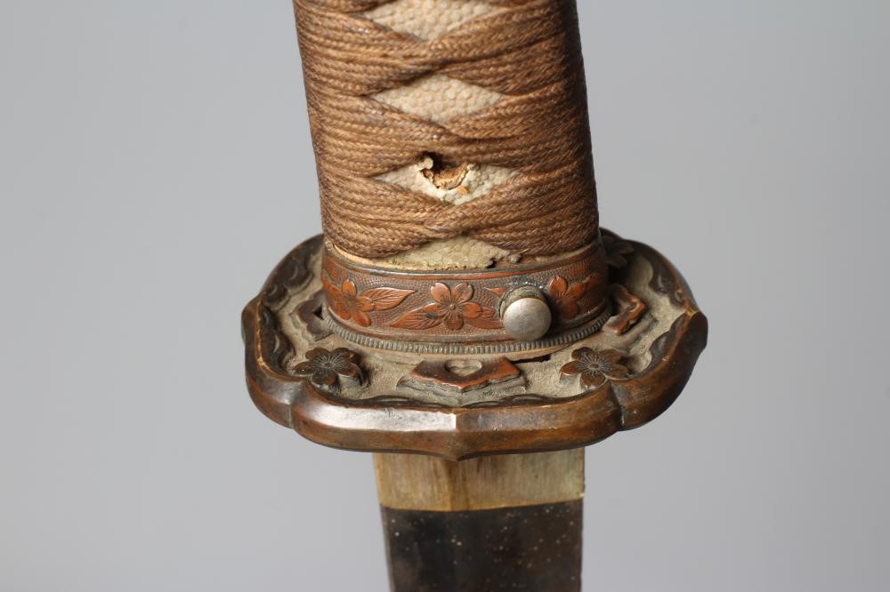 A JAPANESE KATANA with 24 1/2" curved blade, mildly undulating hamon, tang signed and painted, WWII Image