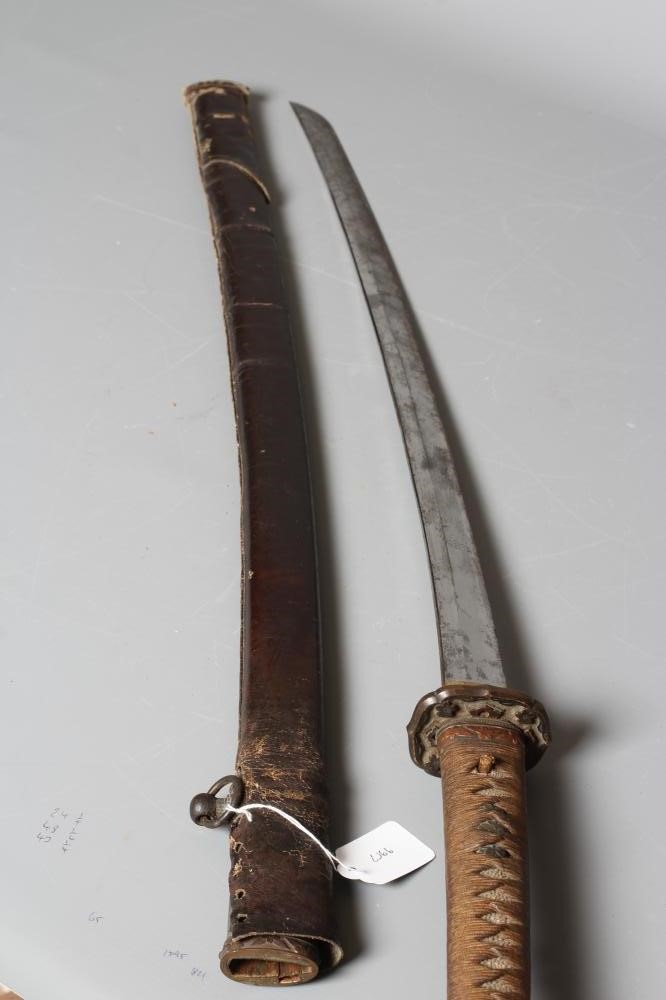 A JAPANESE KATANA with 24 1/2" curved blade, mildly undulating hamon, tang signed and painted, WWII Image