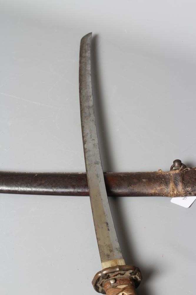 A JAPANESE KATANA with 24 1/2" curved blade, mildly undulating hamon, tang signed and painted, WWII Image