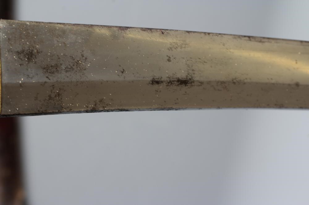 A JAPANESE KATANA with 24 1/2" curved blade, mildly undulating hamon, tang signed and painted, WWII Image