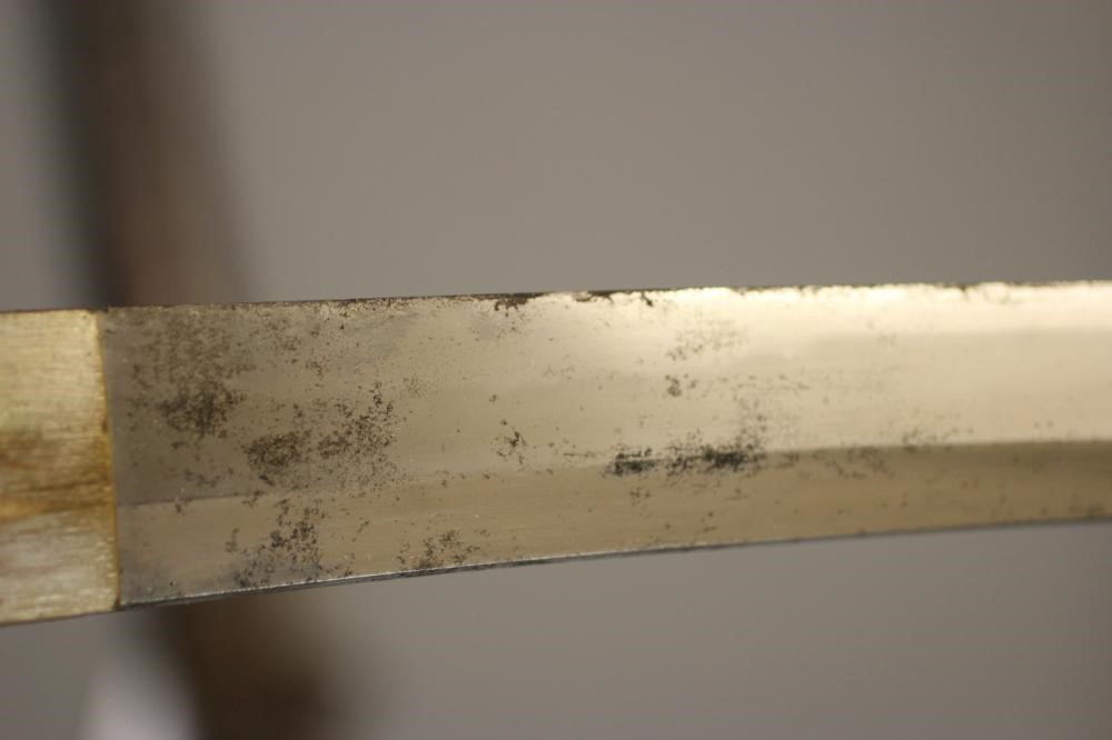 A JAPANESE KATANA with 24 1/2" curved blade, mildly undulating hamon, tang signed and painted, WWII Image