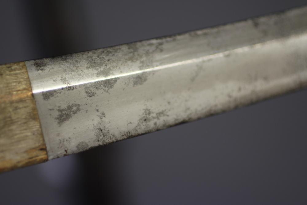 A JAPANESE KATANA with 24 1/2" curved blade, mildly undulating hamon, tang signed and painted, WWII Image