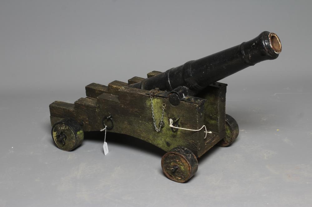 A DECORATIVE CANNON, early 20th century, with cast metal 28 1/2" barrel section, rear knob, twin Image