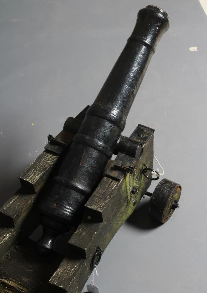 A DECORATIVE CANNON, early 20th century, with cast metal 28 1/2" barrel section, rear knob, twin Image