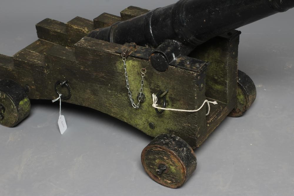 A DECORATIVE CANNON, early 20th century, with cast metal 28 1/2" barrel section, rear knob, twin Image