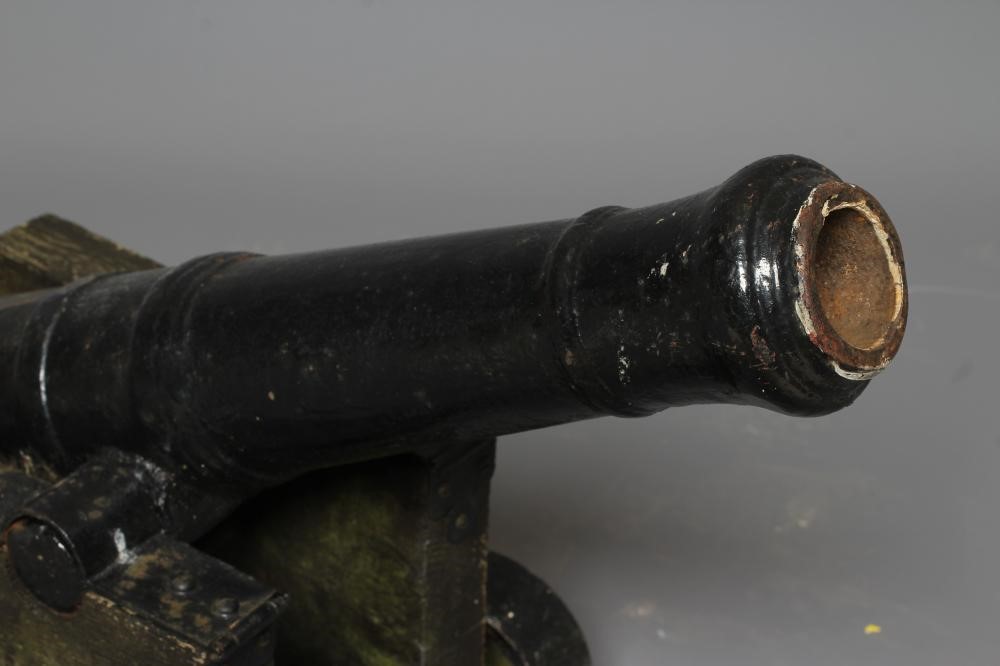 A DECORATIVE CANNON, early 20th century, with cast metal 28 1/2" barrel section, rear knob, twin Image