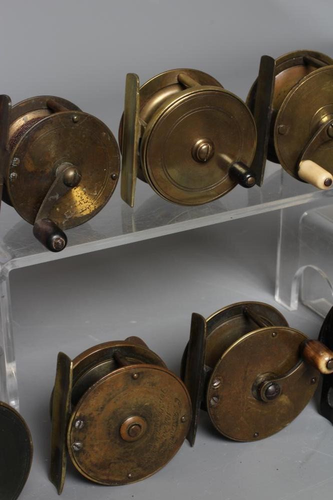 TWELVE ANTIQUE BRASS FISHING REELS, the majority with bone and horn handles, largest 3" diameter Image