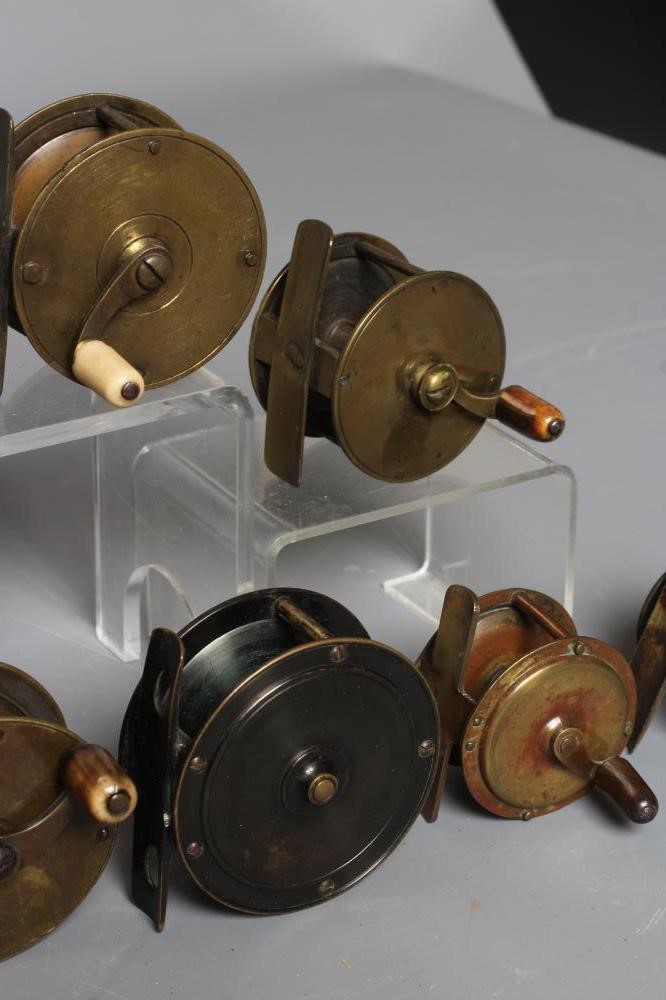 TWELVE ANTIQUE BRASS FISHING REELS, the majority with bone and horn handles, largest 3" diameter Image