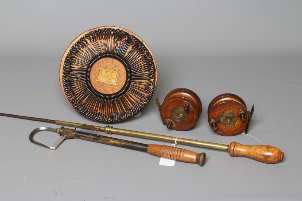 A MUSTAD & SON SEA HOOKS ADVERTISING BOARD, together with two antique star back reels and two gaffs Image