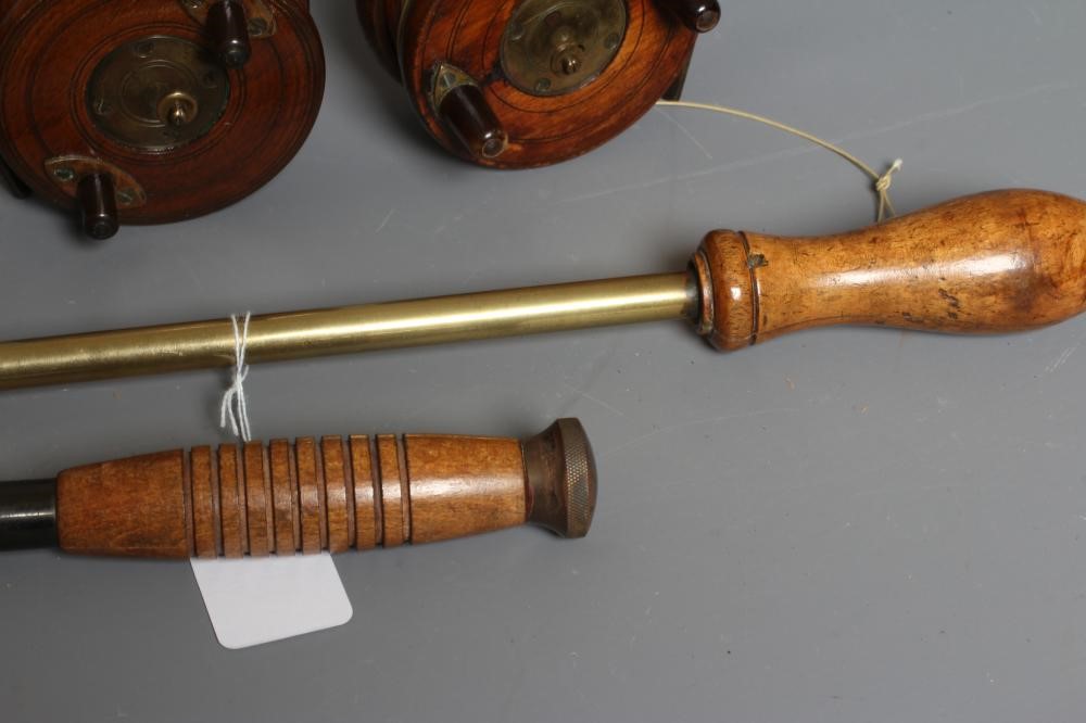 A MUSTAD & SON SEA HOOKS ADVERTISING BOARD, together with two antique star back reels and two gaffs Image