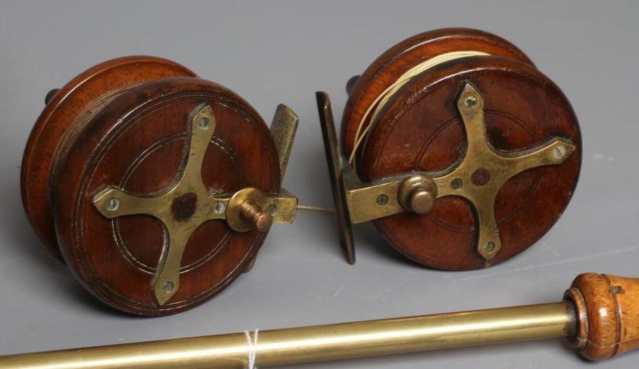 A MUSTAD & SON SEA HOOKS ADVERTISING BOARD, together with two antique star back reels and two gaffs Image