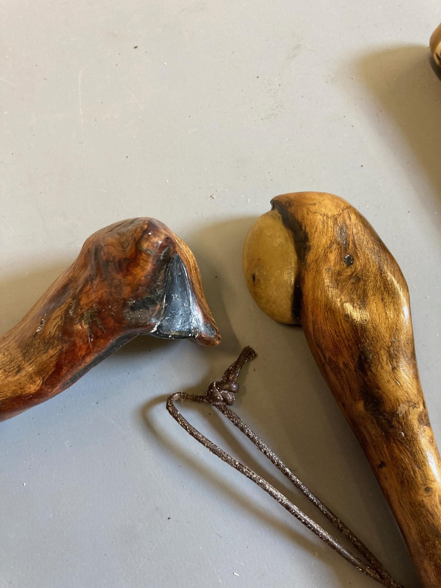 SEVEN ANTIQUE FISHING PRIESTS, four of turned hardwood construction, one root wood with inset Image