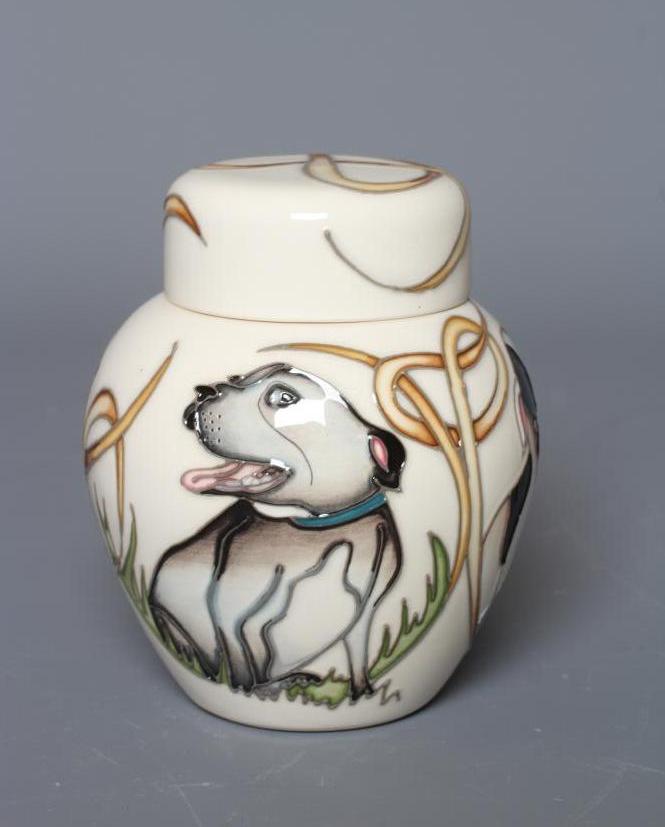 A MOORCROFT POTTERY HAPPY STAFFIES JAR AND COVER, 2019, designed by Vicky Lovatt, impressed and Image