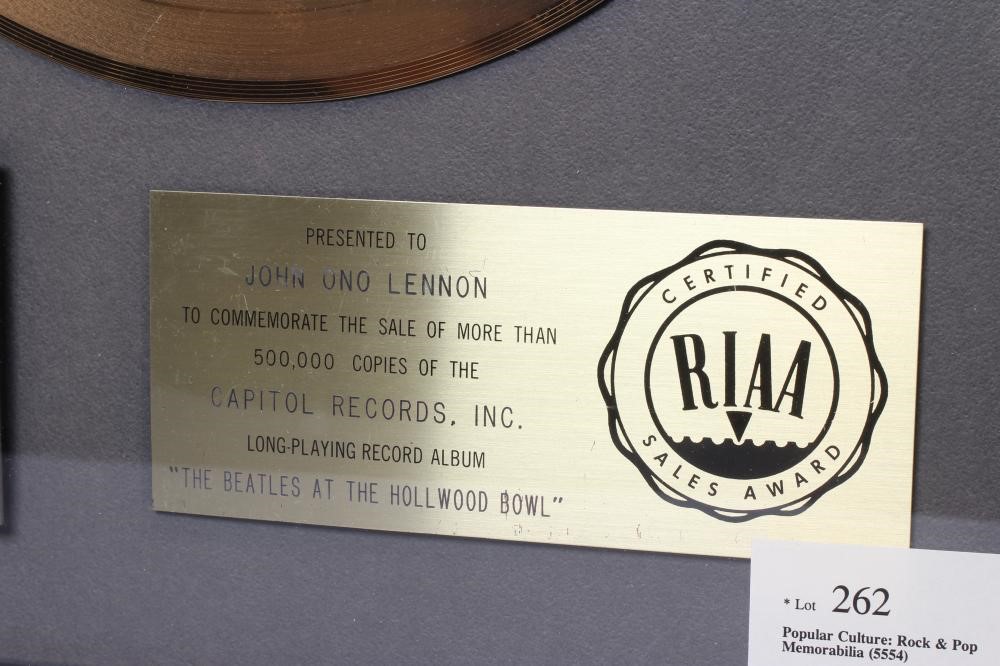A PRESENTATION "GOLD" SALES AWARD for the Capitol Records album The Beatles At The Hollywood Bowl, Image