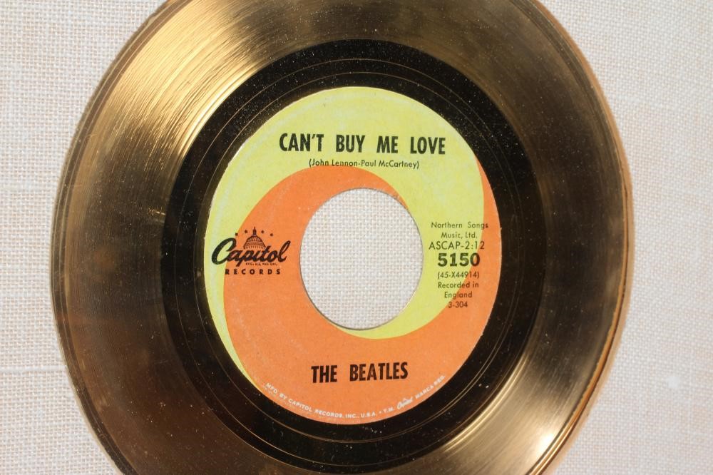 A PRESENTATION "GOLD" SALES AWARD for the single Can't Buy Me Love, R.I.A.A. certified, presented to Image