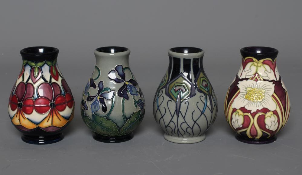 FOUR MOORCROFT POTTERY VASES all of baluster form and comprising Violetta Image