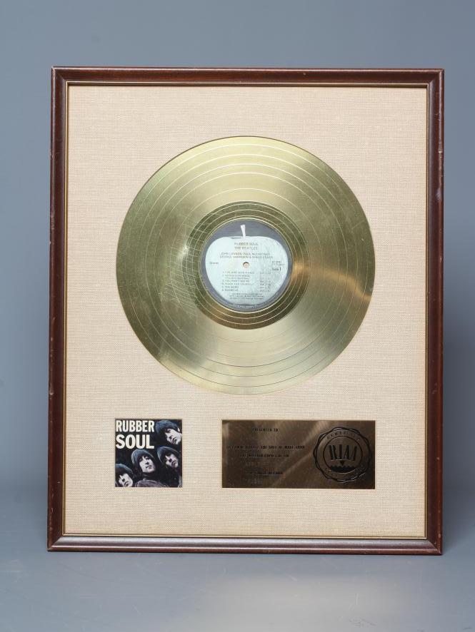A PRESENTATION "GOLD" SALES AWARD for the Apple Records album Rubber Soul Image