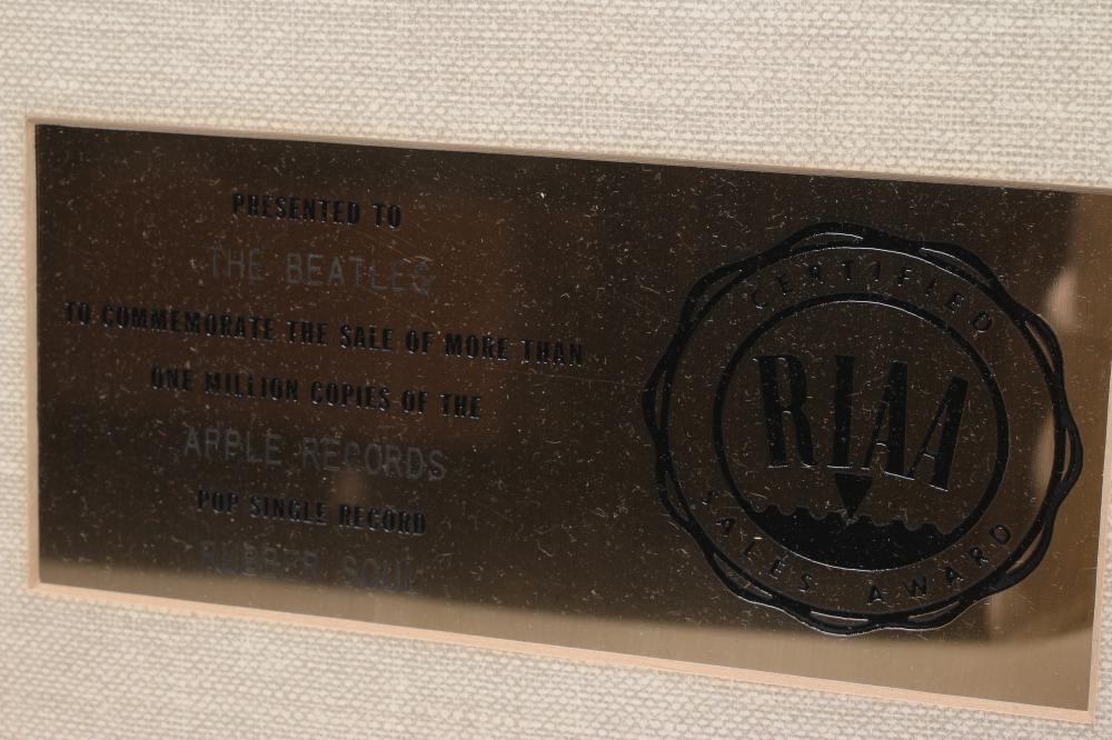 A PRESENTATION "GOLD" SALES AWARD for the Apple Records album Rubber Soul Image