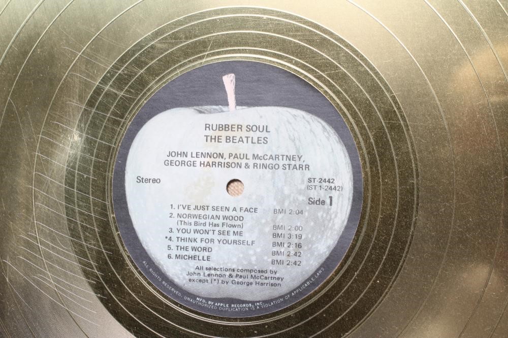 A PRESENTATION "GOLD" SALES AWARD for the Apple Records album Rubber Soul Image