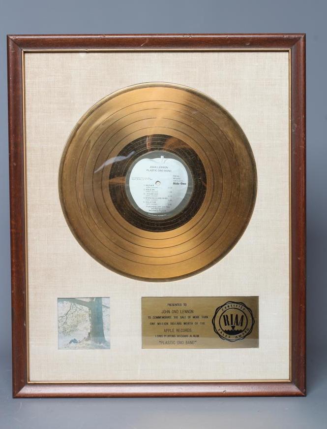 A PRESENTATION "GOLD" SALES AWARD for the Apple Records album Plastic Ono Band Image