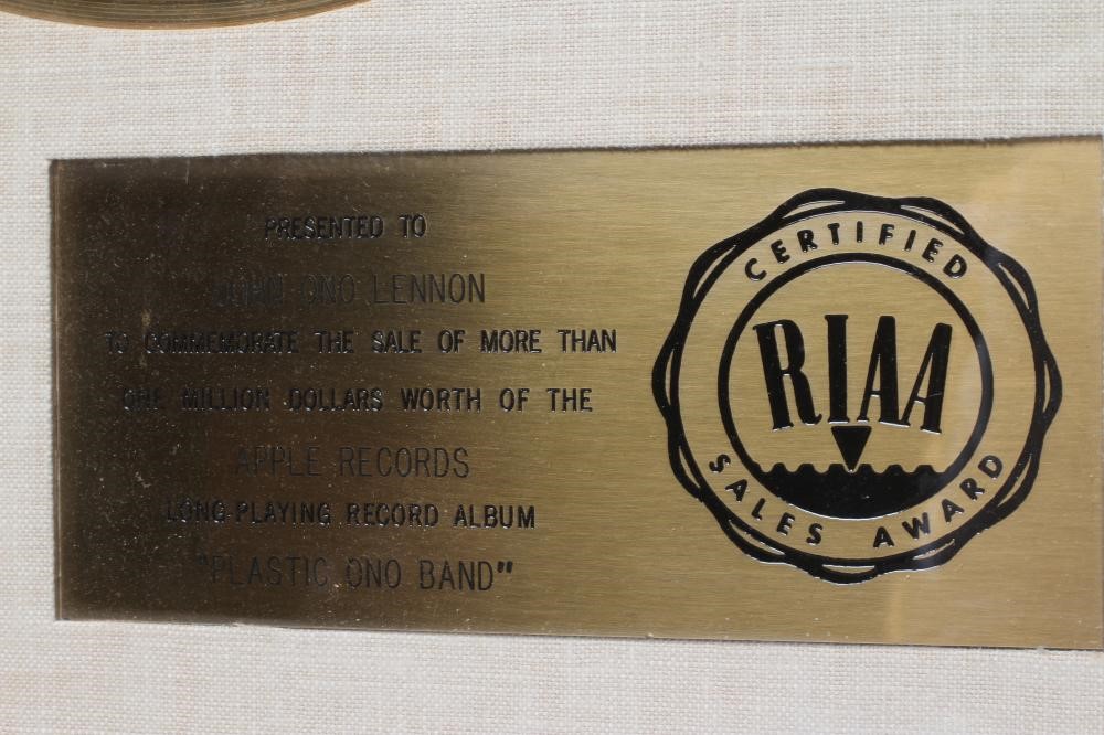 A PRESENTATION "GOLD" SALES AWARD for the Apple Records album Plastic Ono Band Image