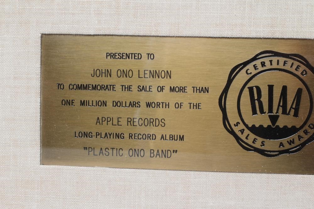 A PRESENTATION "GOLD" SALES AWARD for the Apple Records album Plastic Ono Band Image