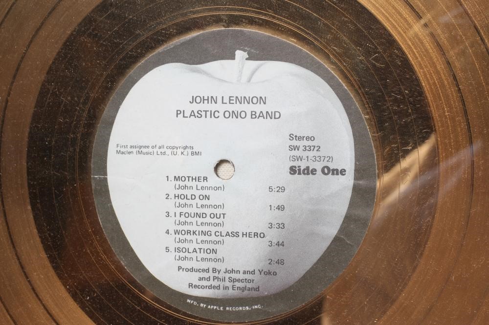 A PRESENTATION "GOLD" SALES AWARD for the Apple Records album Plastic Ono Band Image