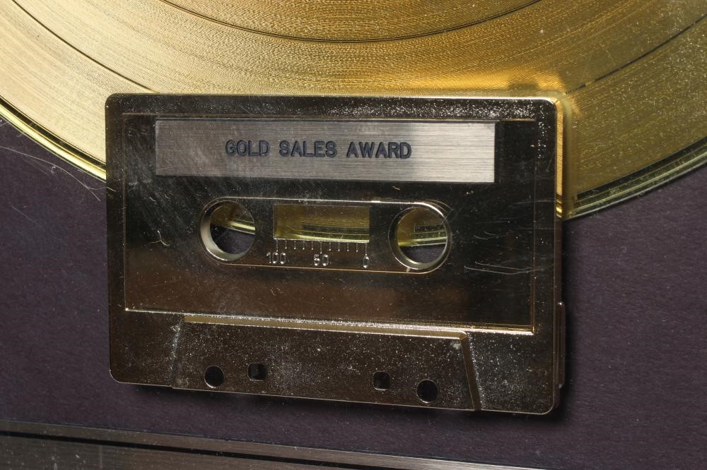 A PRESENTATION "GOLD" SALES AWARD for the album David Bowie Let's Dance, with record and tape Image
