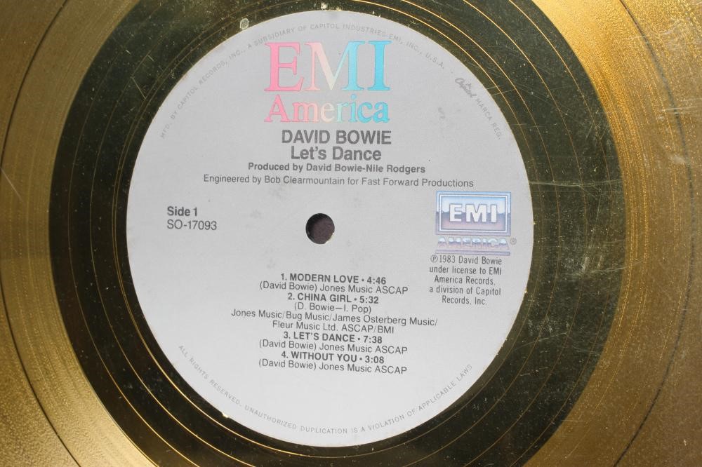 A PRESENTATION "GOLD" SALES AWARD for the album David Bowie Let's Dance, with record and tape Image
