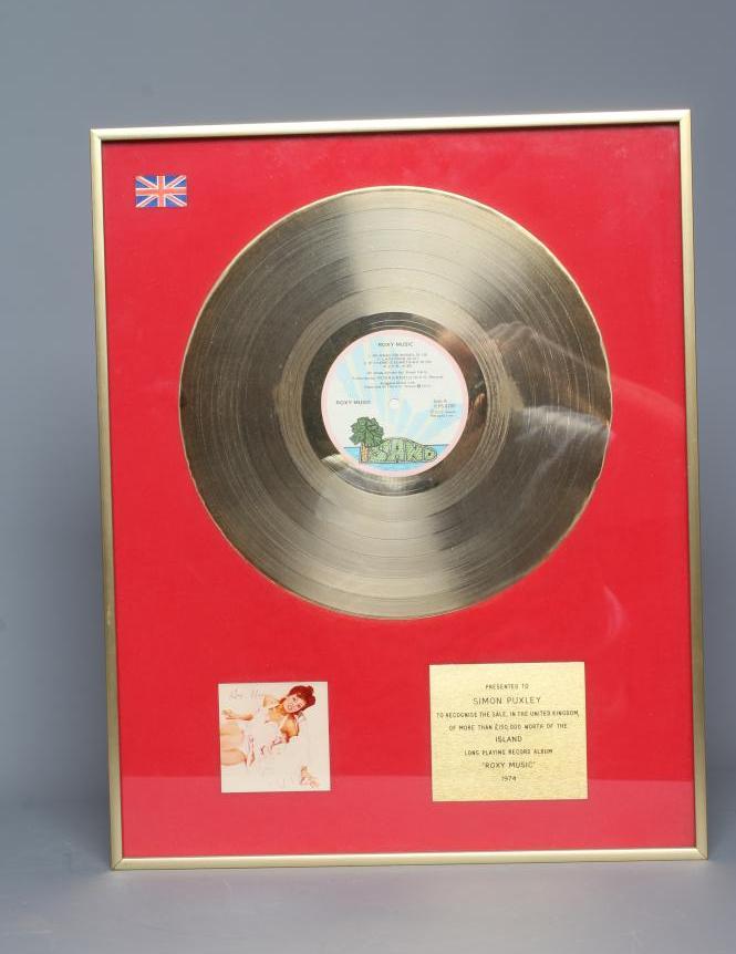 A PRESENTATION "GOLD" SALES AWARD for the album Roxy Music The Island, presented to Simon Puxley, 16 Image