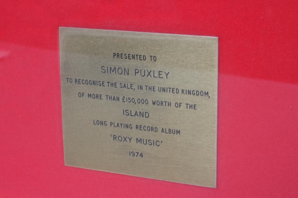 A PRESENTATION "GOLD" SALES AWARD for the album Roxy Music The Island, presented to Simon Puxley, 16 Image