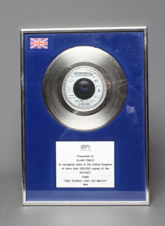 A PRESENTATION "SILVER" SALES AWARD for the Rocket single Sad Songs (Say So Much) by Elton John, Image