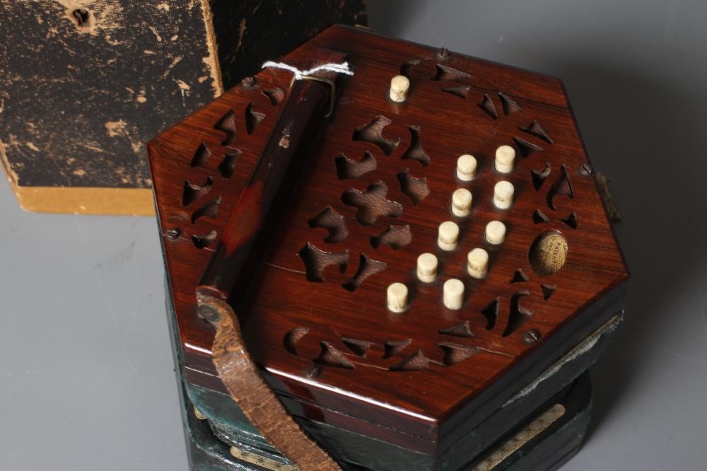 A LACHENAL AND CO. MAHOGANY CONCERTINA, 19th century, of hexagonal form with five fold leather Image