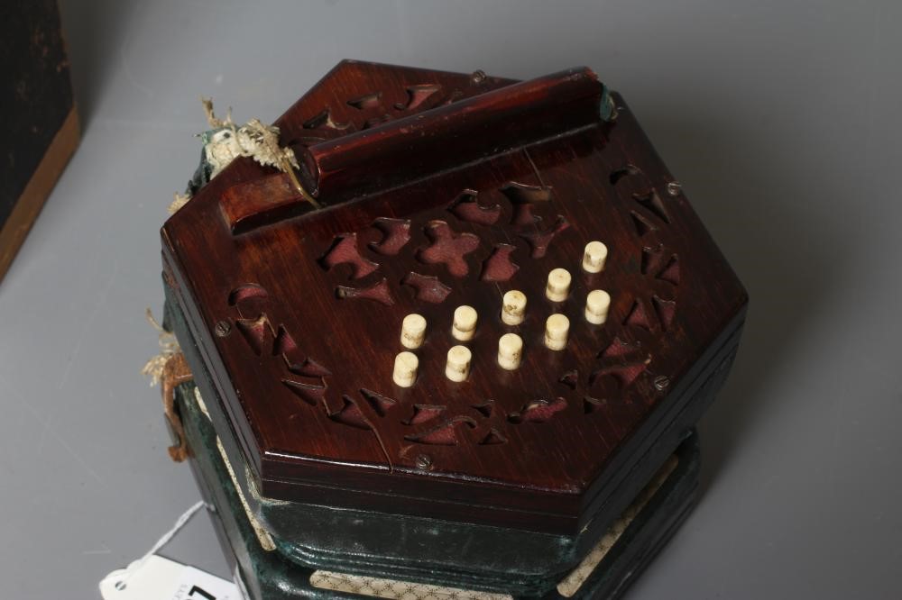 A LACHENAL AND CO. MAHOGANY CONCERTINA, 19th century, of hexagonal form with five fold leather Image