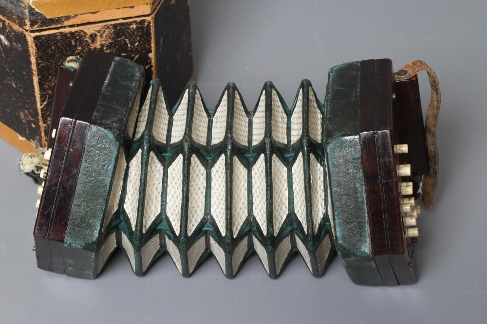 A LACHENAL AND CO. MAHOGANY CONCERTINA, 19th century, of hexagonal form with five fold leather Image